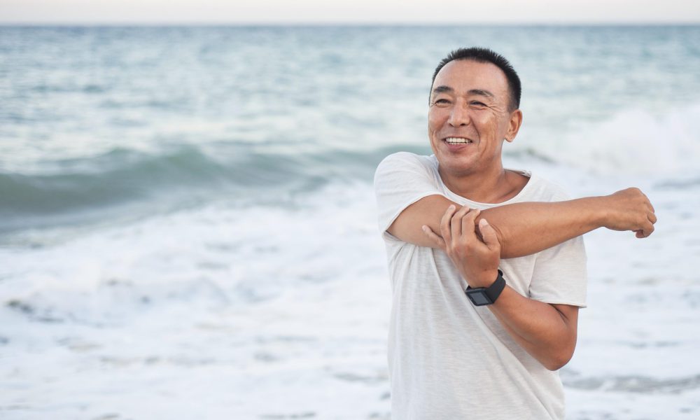 medium-shot-smiley-man-stretching-arm